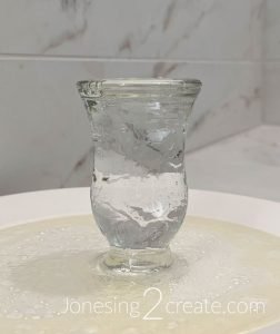 Water pushing the oil out of the glass